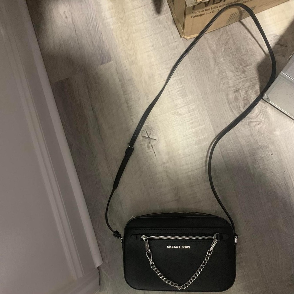 Micheal Kors small purse $70 plus shipping black with silver chain.